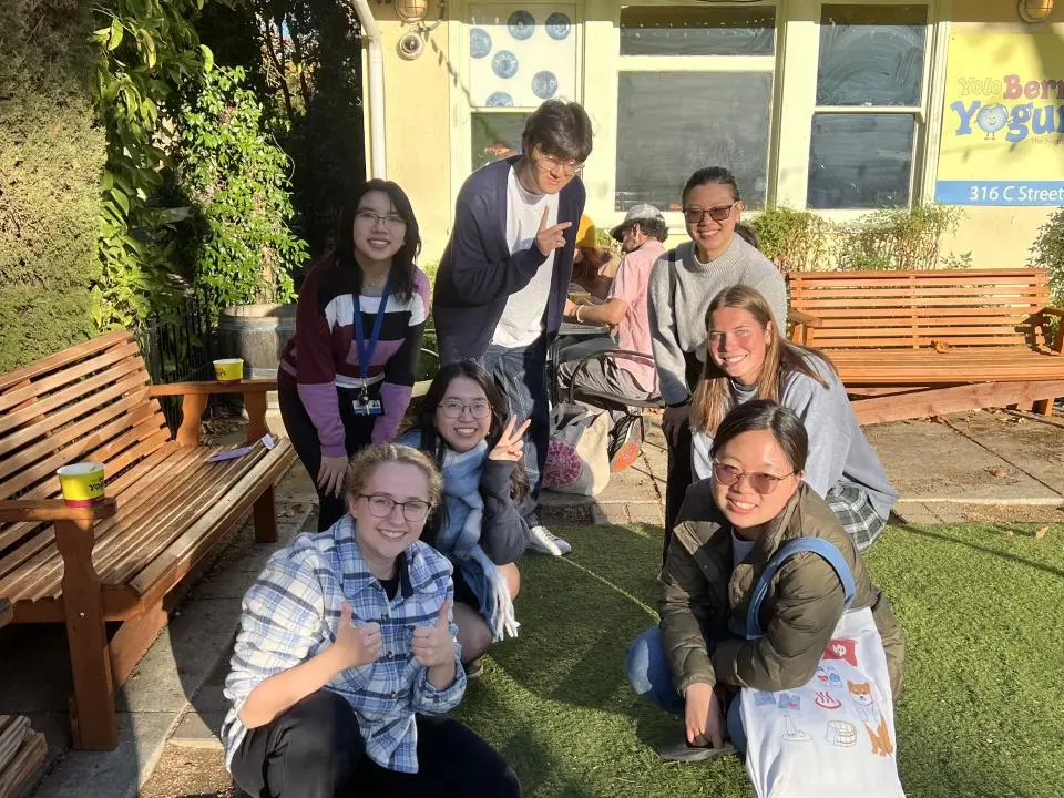 Sage Taylor and other MPAc students in a courtyard