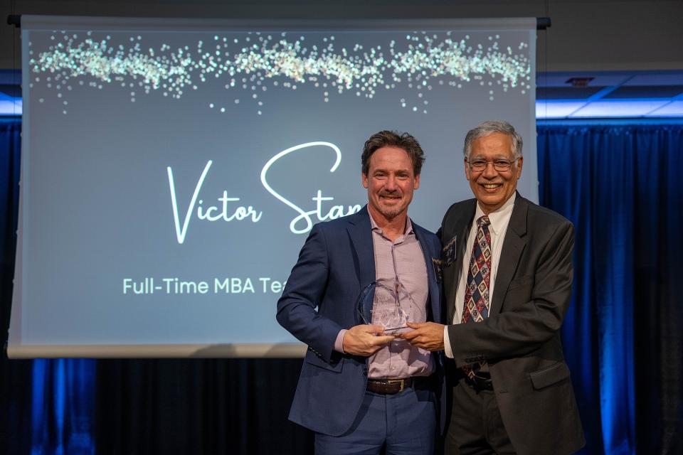 Victor Stango on-stage receiving award from Dean Rao Unnava