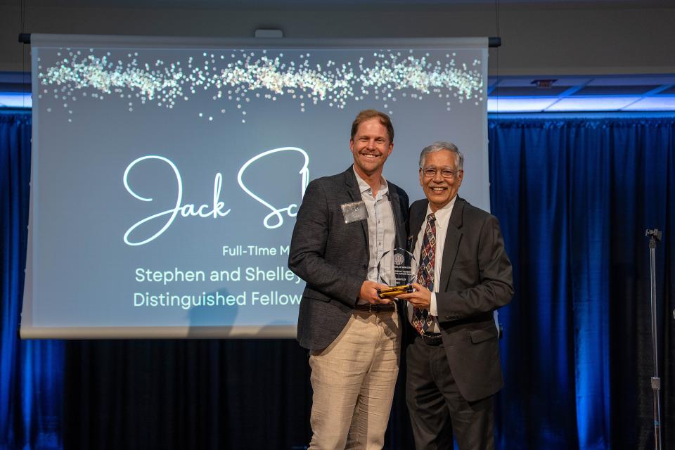 Jack Schaufler on-stage receiving award from Dean Rao Unnava