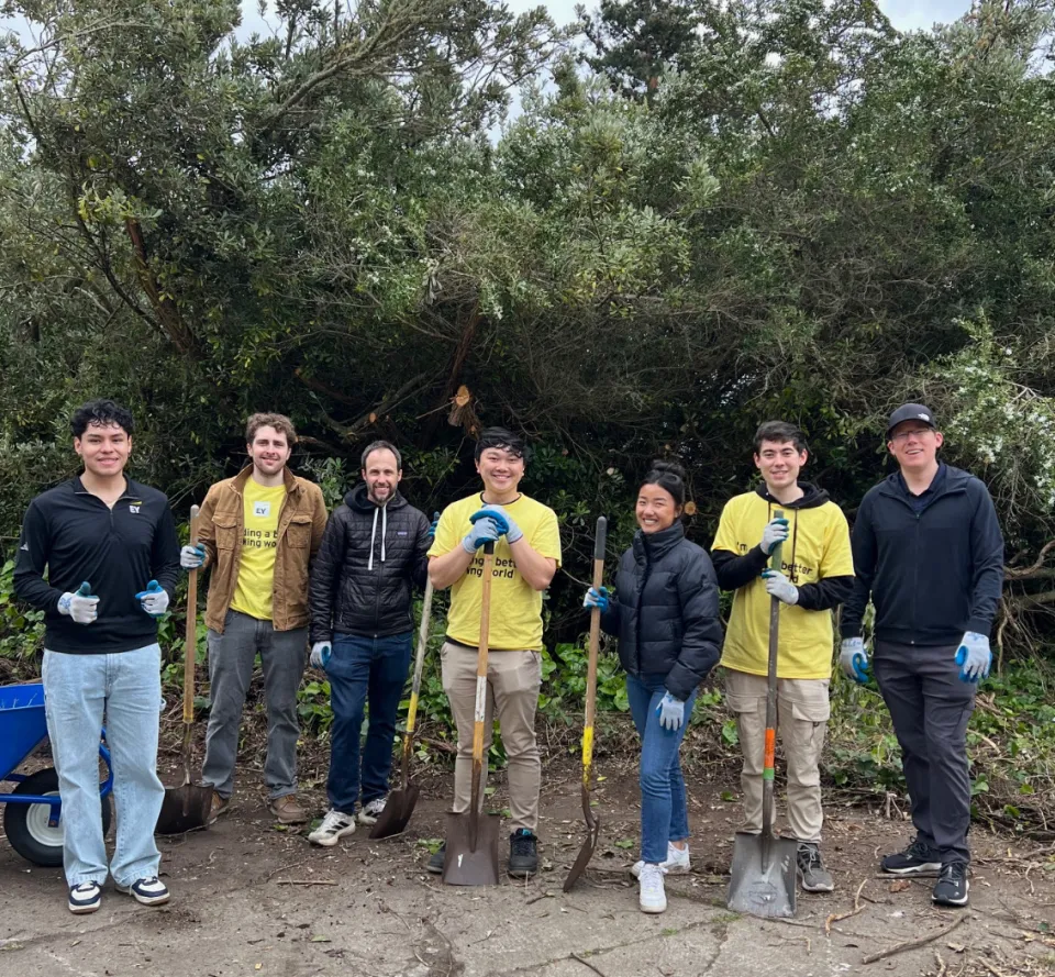 Eduardo Casarubias outside with EY employees
