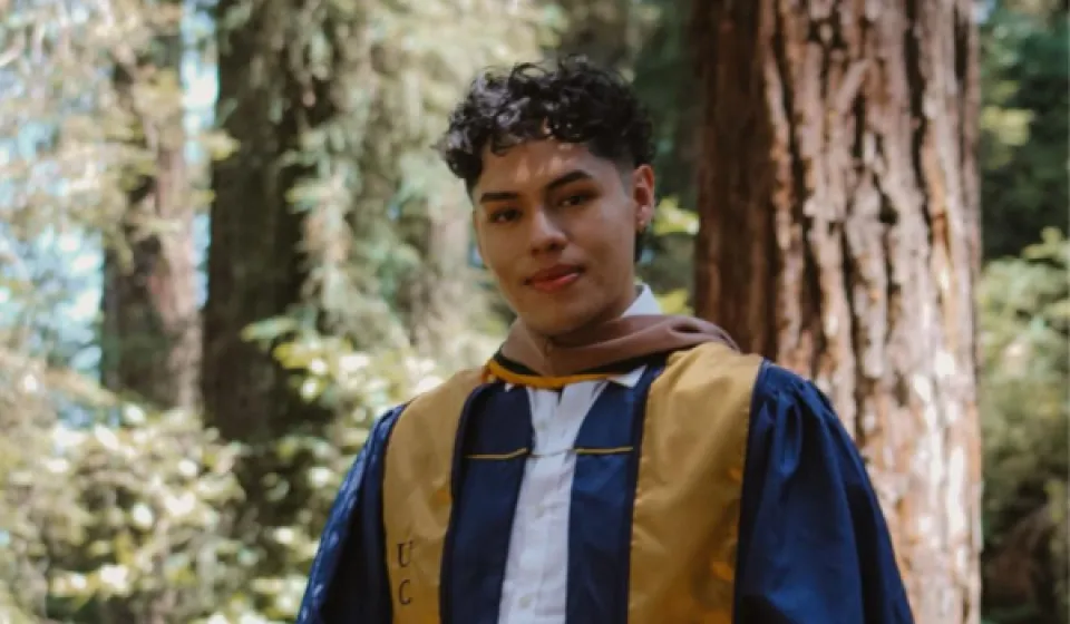 Eduardo Casarubias wearing a graduation robe