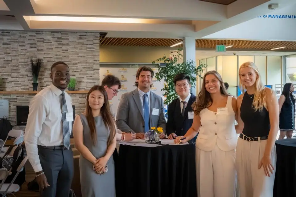 a group of Master of Management students in Gallagher Hall
