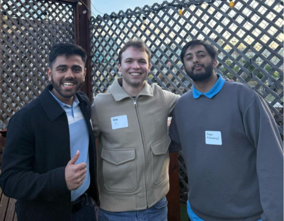 Vatsal Nanawati, Henri Jenoudet and Furqan Mohammed standing in a patio