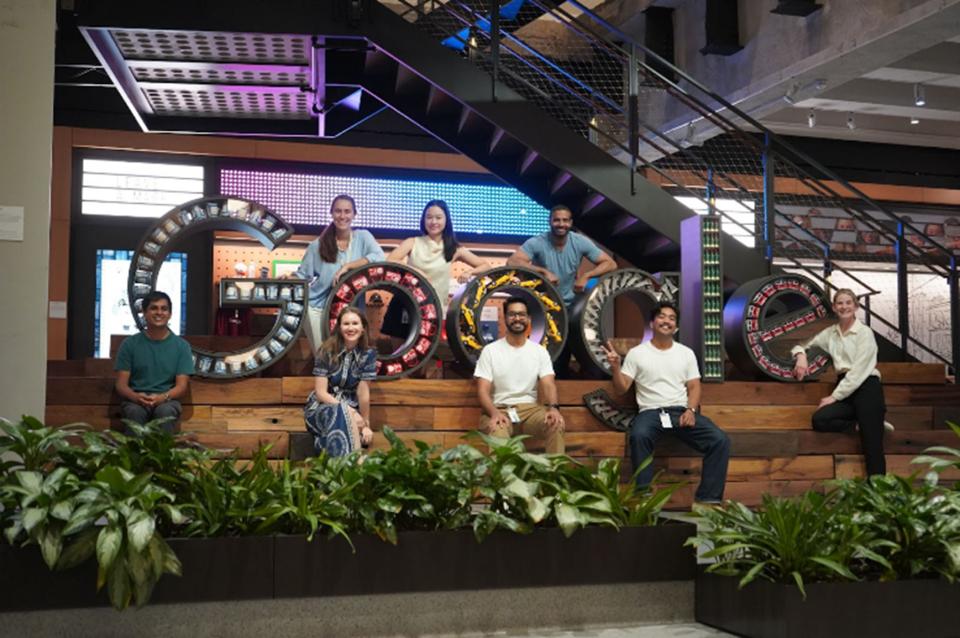 people in front of Google sign