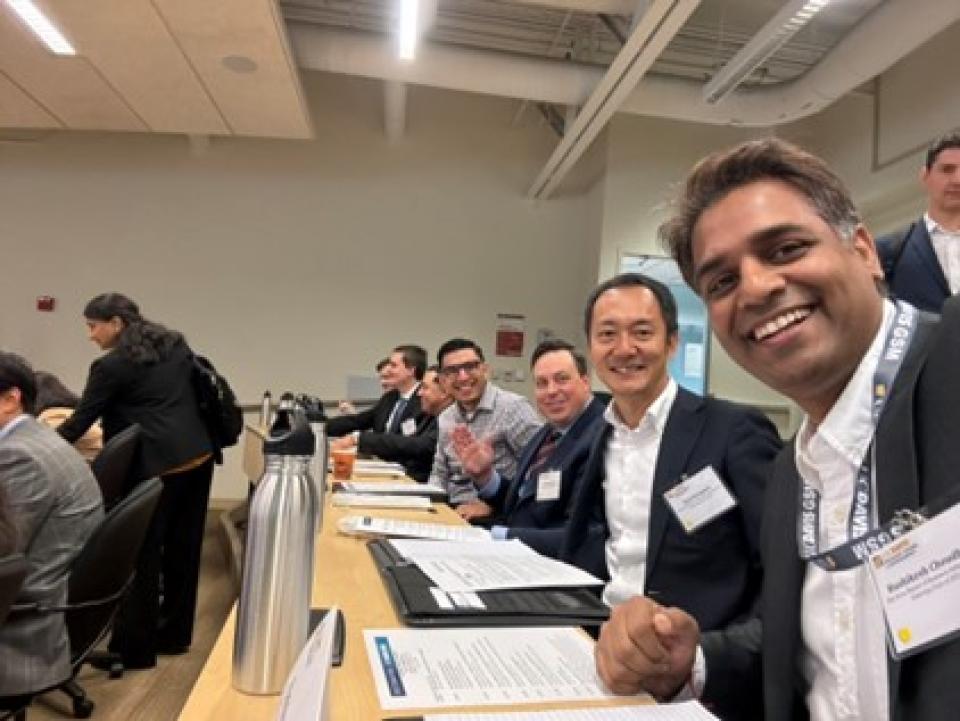 Rushikesh Choudhury with other Bay Area MBA students in a classroom