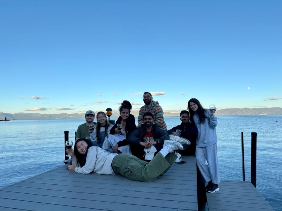 MBA students pose on a pier in Lake Tahoe