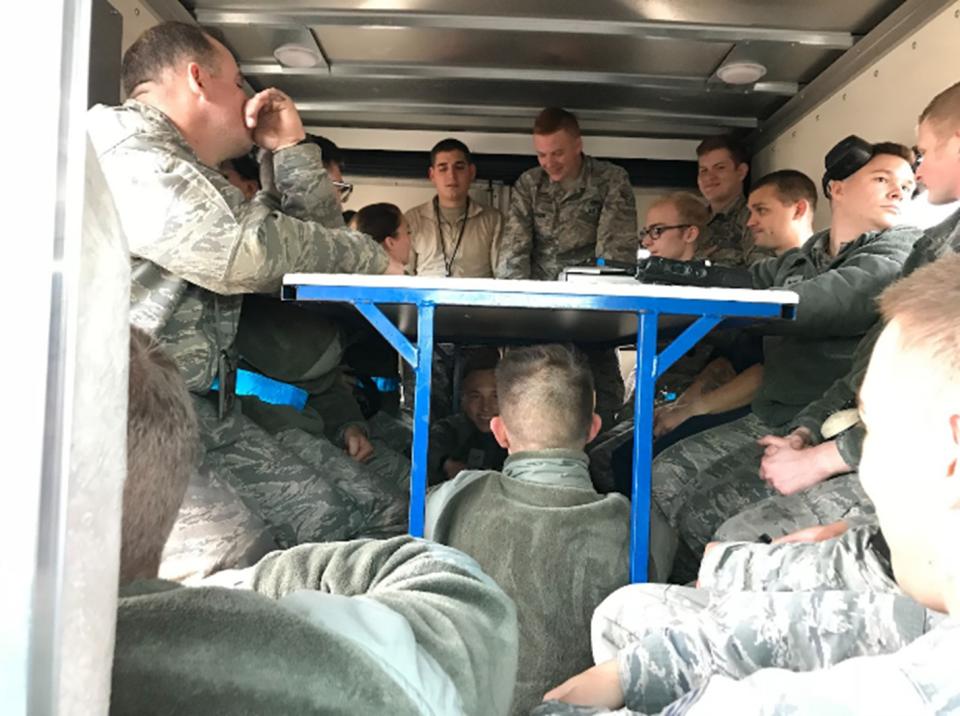 Andre Paradiang (not pictured) rides with fellow airmen in the expediter truck