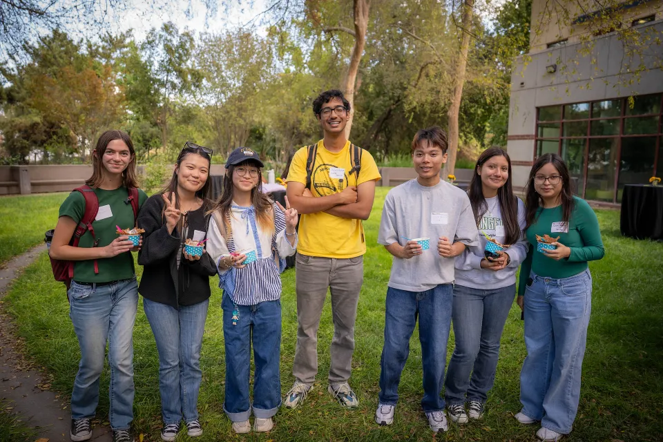 Business major students at an event on campus