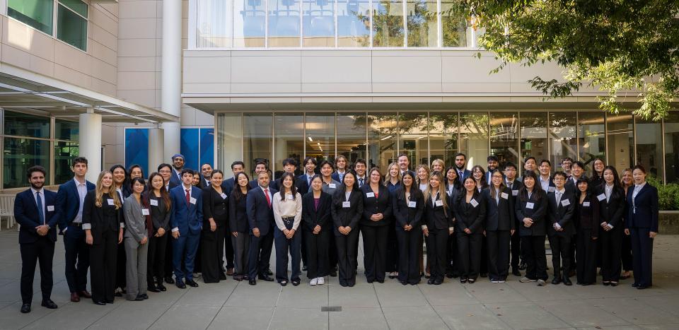Students dressed in office attire