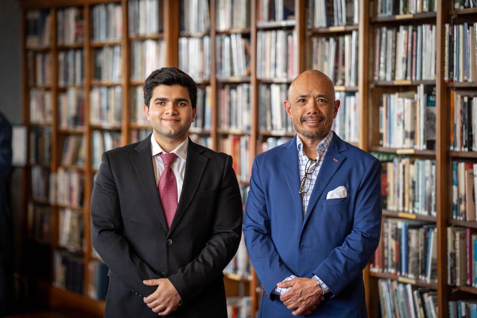 Talha Amin andJerry Abiog standing side-by-side in professional attire