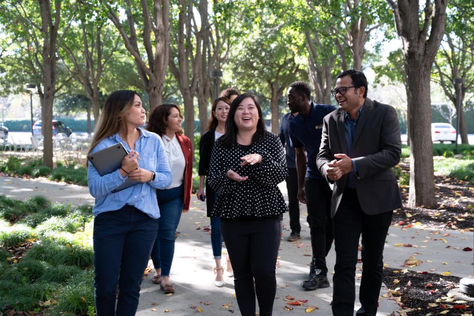 Bay Area MBA students take a break from class on the patio outside Bishop Ranch.