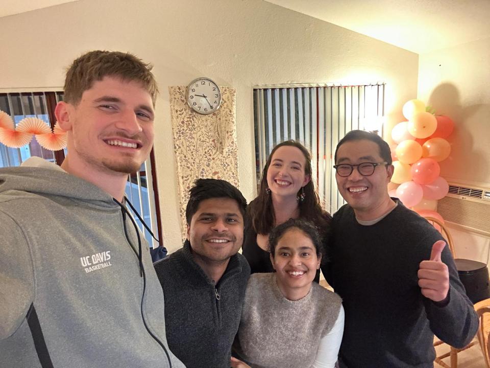 Natalie Webster, Niko Ročak, Rajat Raj Jha, Shabdita Pareek and Jinwon Yoon standing in a group, smiling and holding up thumbs up