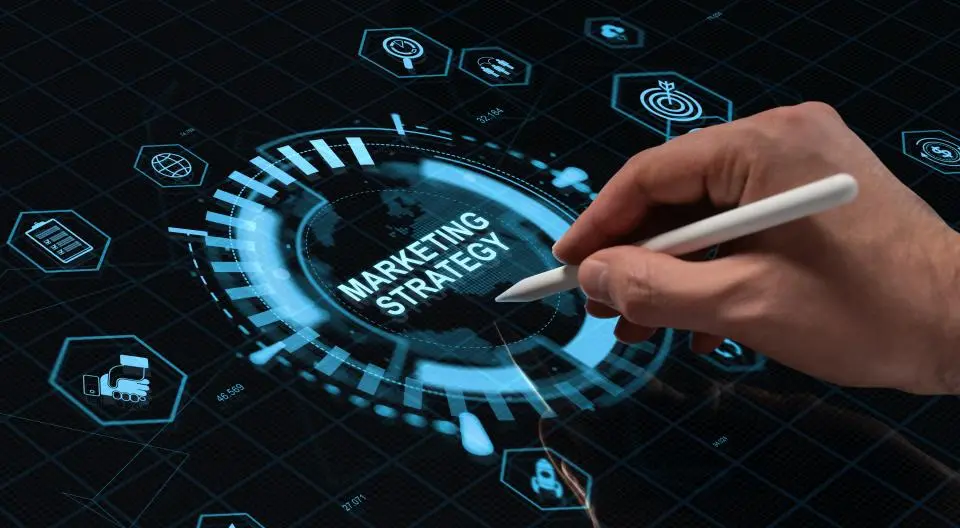 Graphic showing hand writing with pen on computer marketing strategy