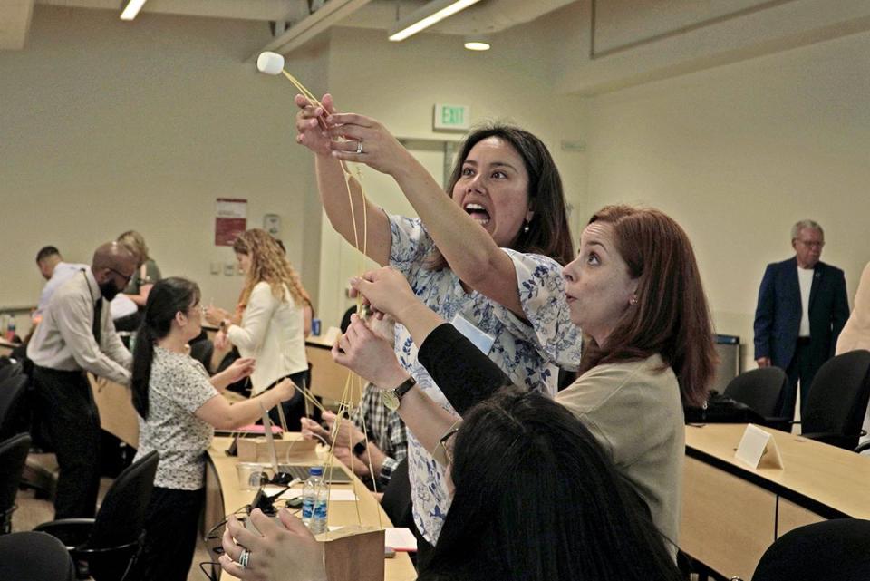 2023 Leadership Academy participants doing a marshmallow tower exercise