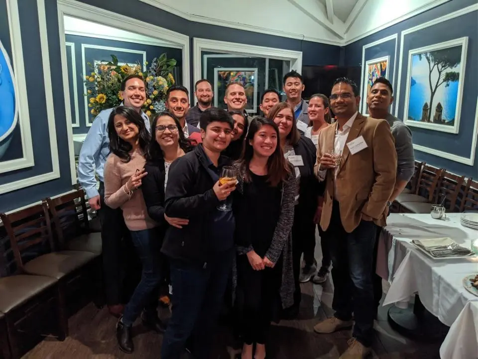Manik Chandrasekhar with the 2019 Bay Area Part-Time MBA Cohort at a restaurant