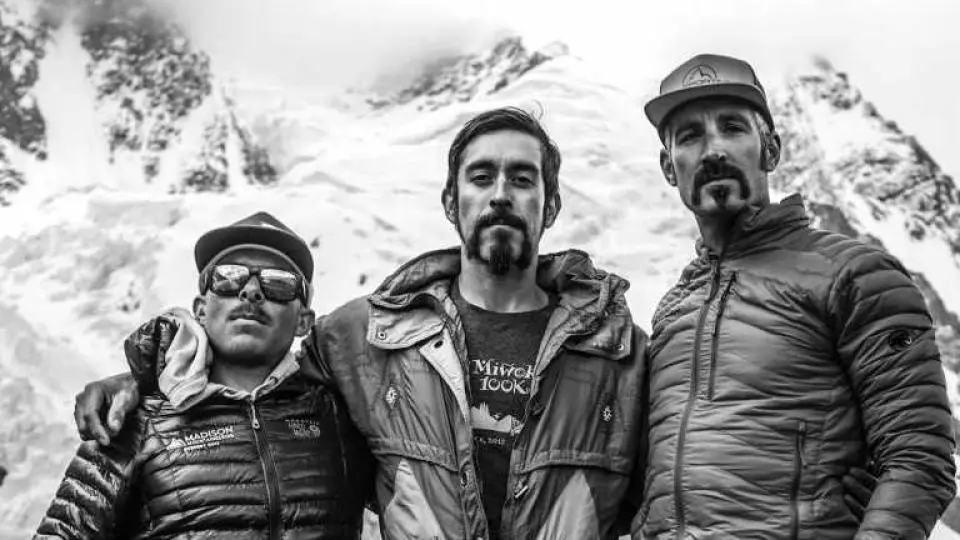 Jesse Rosales with teammates on the mountain