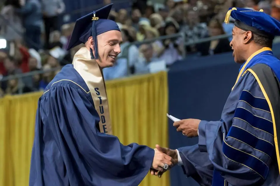 Max O'Rourke shakes Chancellor May's hand at UC Davis commencement