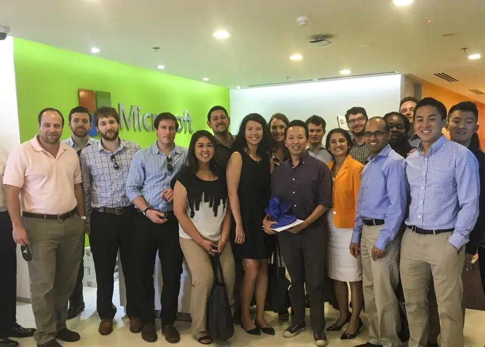 Lecturer Suzy Taherian and a group of students at a Microsoft office in Vietnam