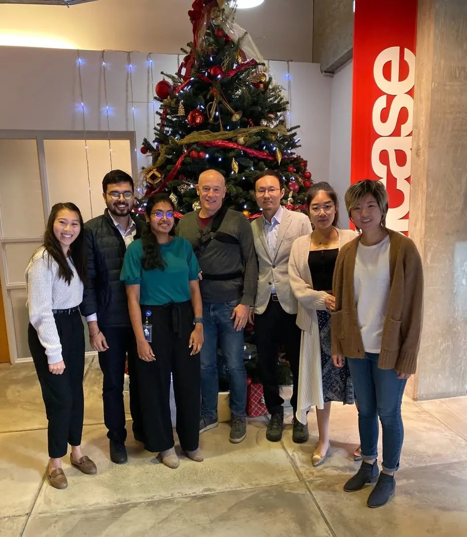 Jacqueleine Ngo with her practicum team and industry mentor Charlie Crocker in front of a Christmas tree at the California Pacific Medical Center Research Institute in San Francisco