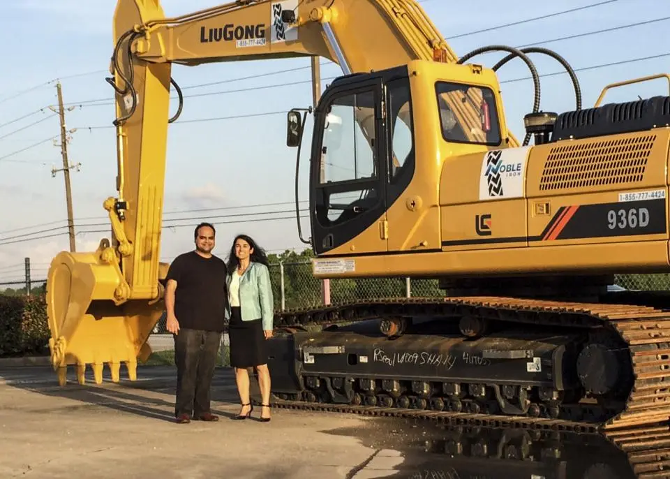Taherian and an excavator at a previous job of CFO of a publicly-traded Canadian company renting excavators