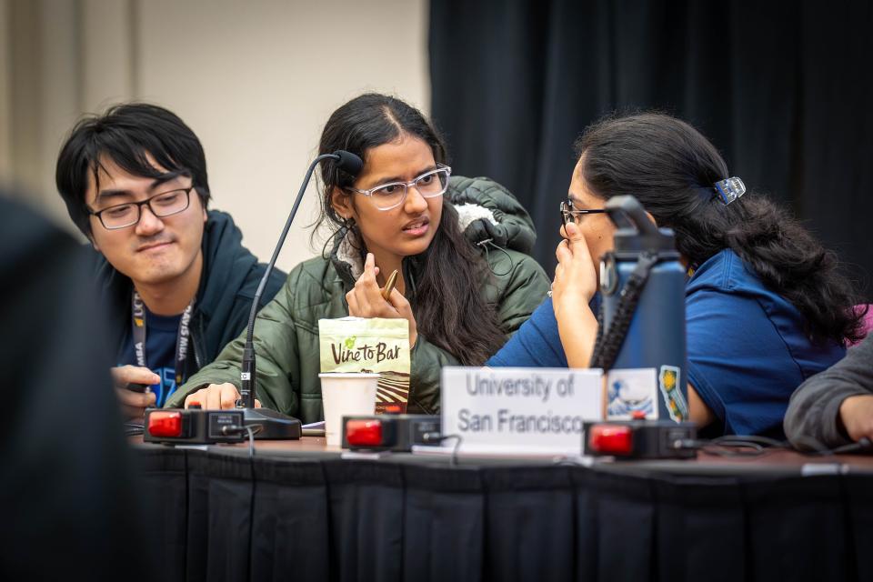 three UC Davis students participating in Biz Quiz