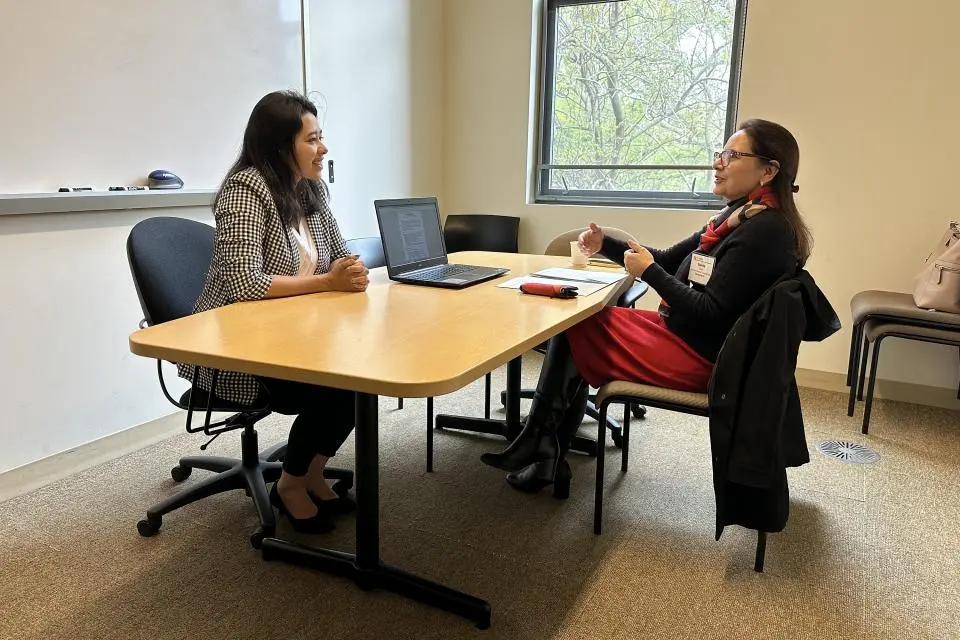 Sraboni Saha and Sunita Dhar in a study room at Gallagher Hall