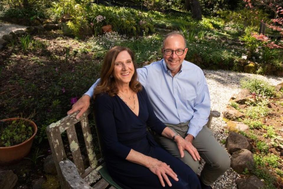 Michael C. and Renée Z. Child sitting on a bench in the UC Davis arboretum