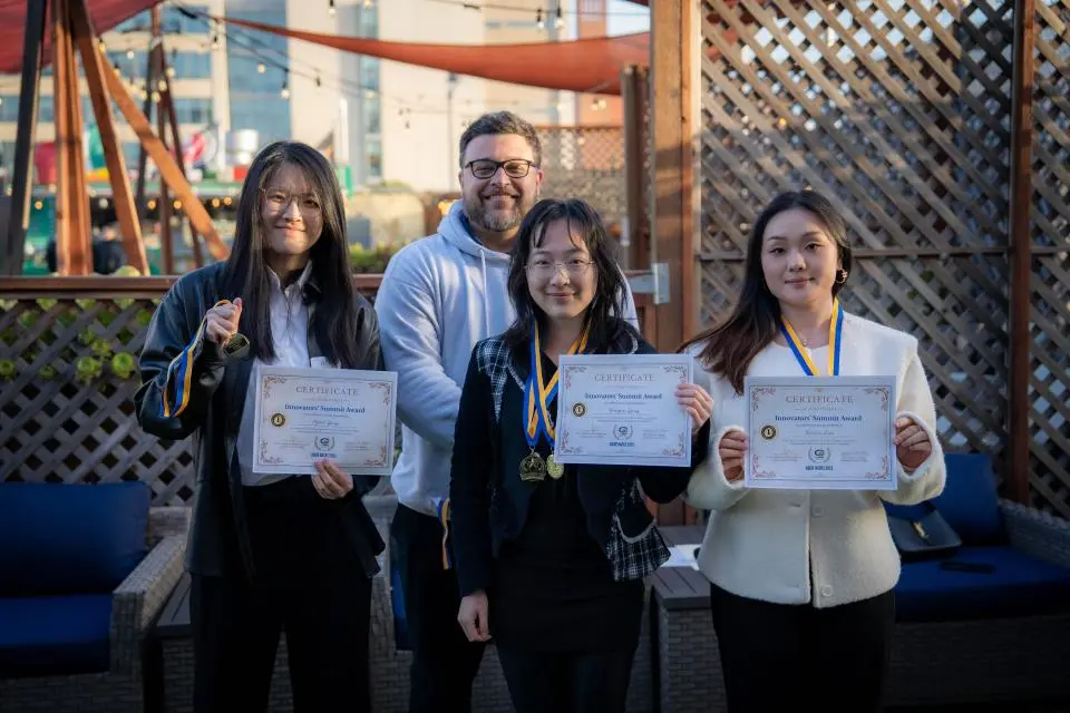 MSBA Hackathon winners hold up their certificates 