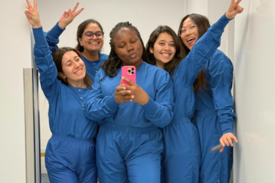 Temidire Dada and MBA students posing for a selfie