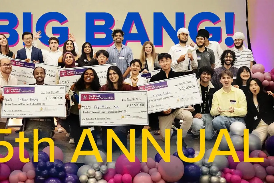 winners on stage with checks
