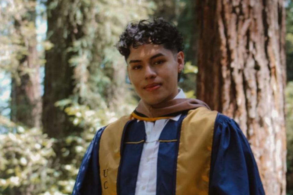Eduardo Casarubias wearing a graduation robe