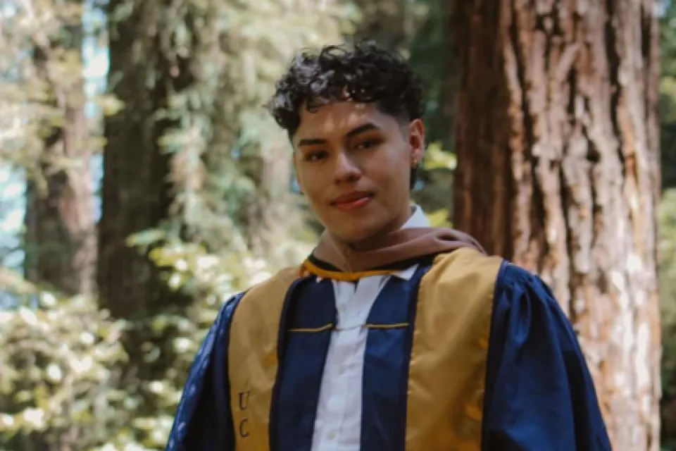 Eduardo Casarubias wearing a graduation robe