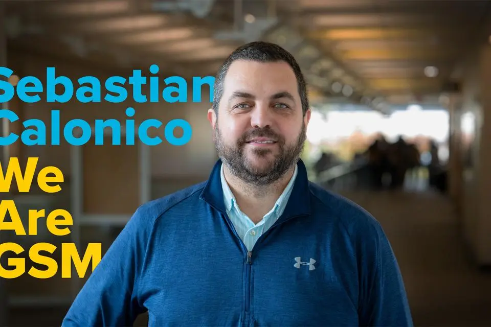 A man in a blue jacket stands indoors; text next to him reads "Sebastian Calonico We Are GSM.