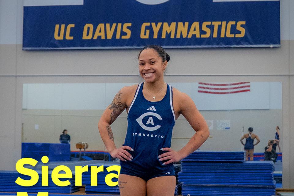 Sierra Muns standing on gymnastics mat